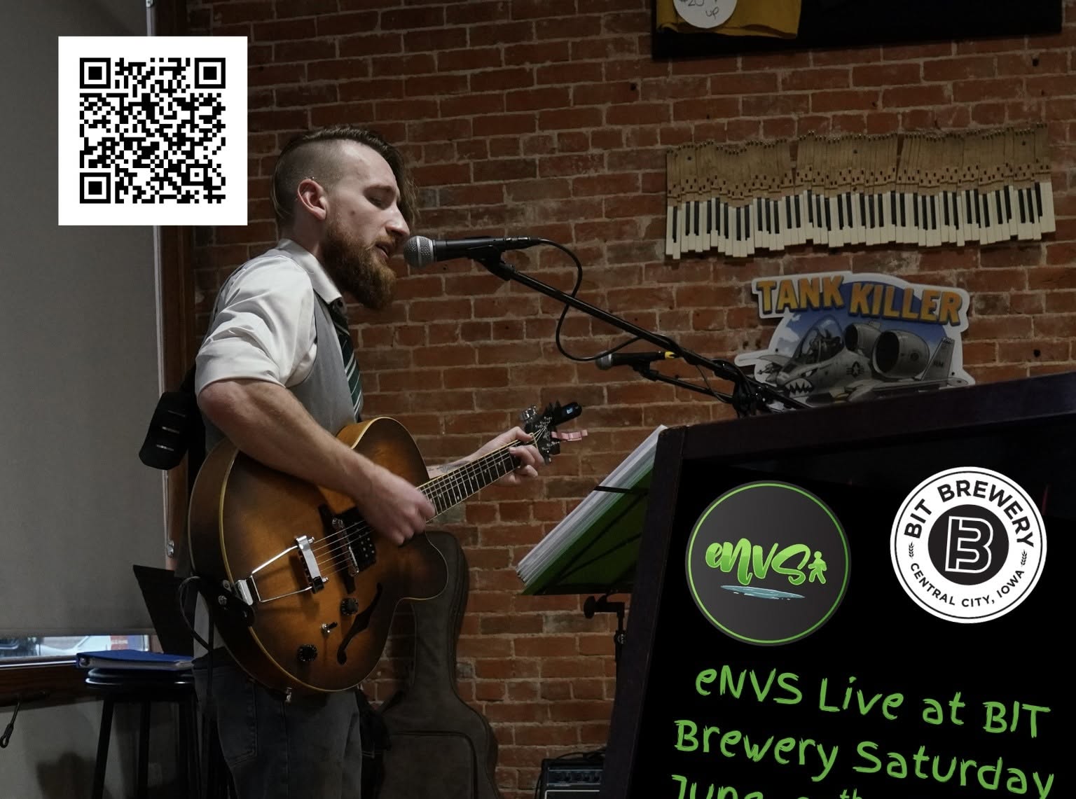 photo of Nathan Van Slyke aka eVNS playing guitar at BIT Brewery
