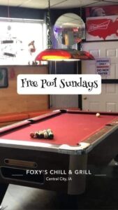 image of a pool table advertising free pool on Sundays of Foxy's Chill & Grill