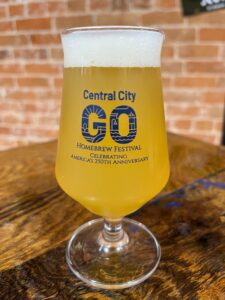 photo of a beer tasting glass featuring the Central City Growth Organization logo, for the 2026 Homebrew Festival on July 4th